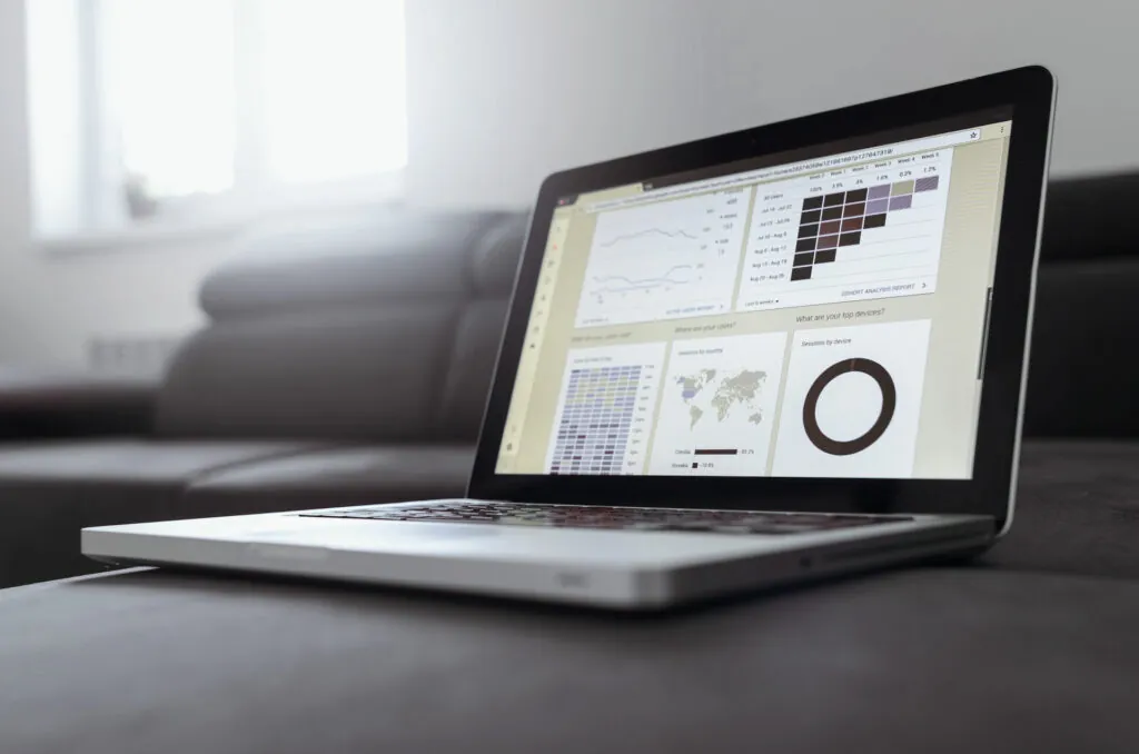 Laptop showing a marketing analytics dashboard with charts